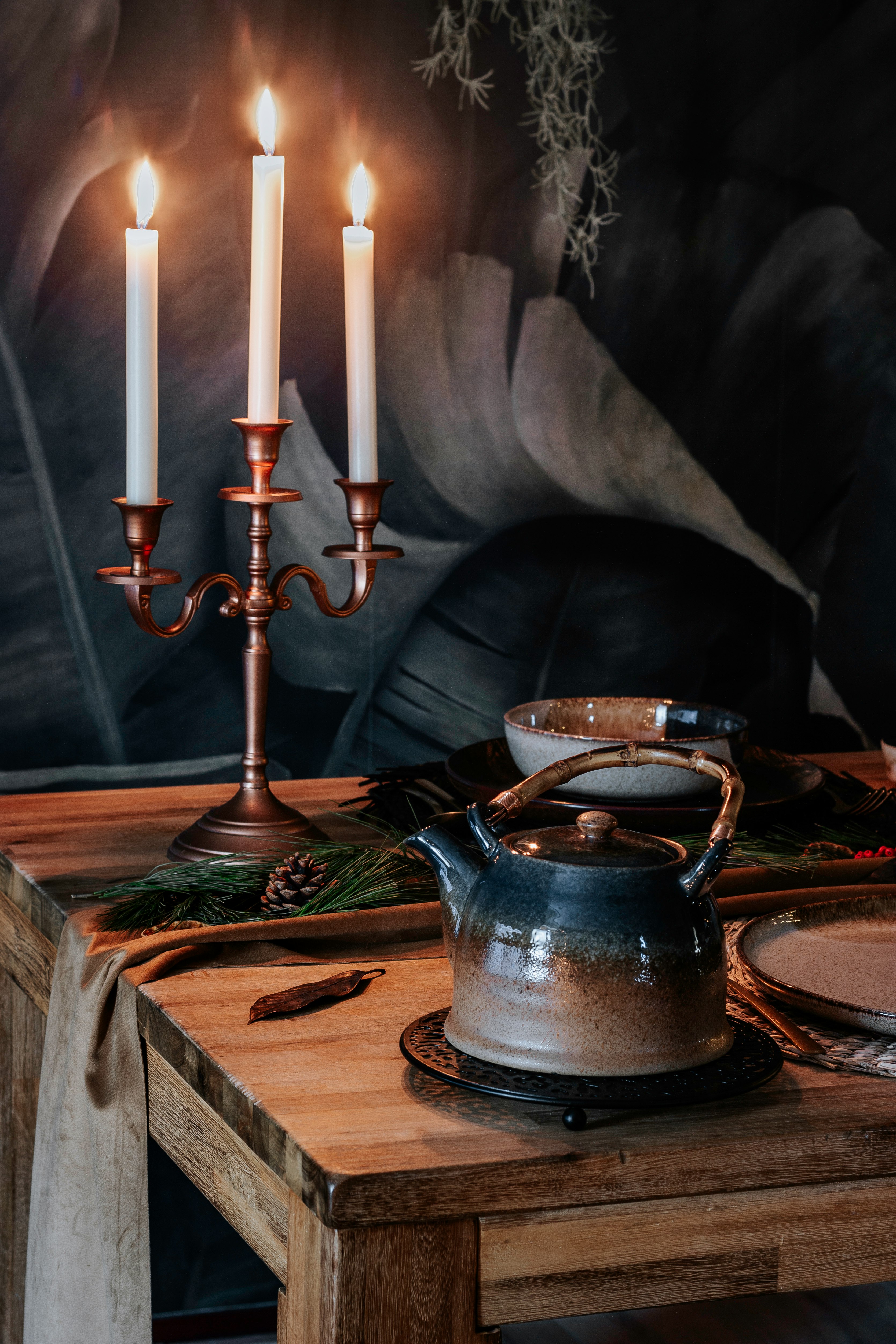 blue ceramic teapot on brown wooden table